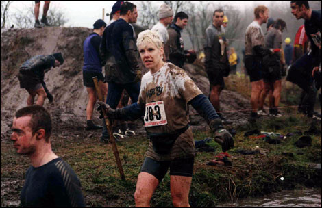 Woman taking part in an assault course.