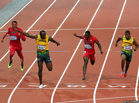 Usain Bolt crosses the finish line in the men's 100m final