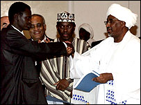 Líder do grupo rebelde e governo dão as mãos