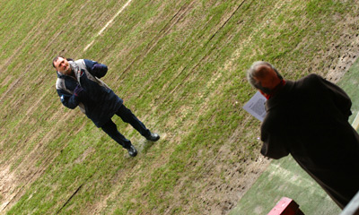 As Simon practises singing, Ray conducts from the pitch