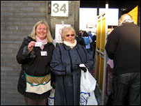 Two women standing  203