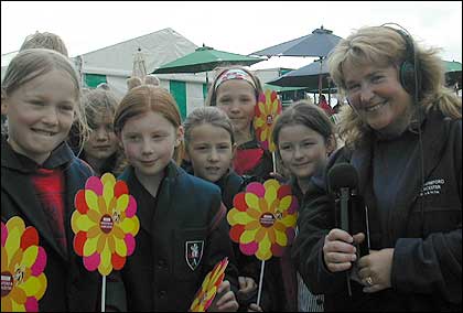 BBC H&Ws Katie Johnson with girls from a school
