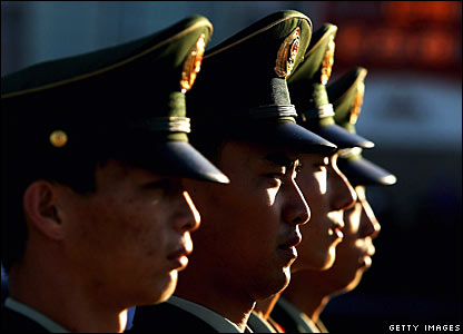 Police stand guard in Tiananmen Square, Beijing.