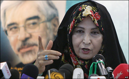 Zahra Rahnavard, wife of the leading reformist presidential candidate Mir Hossein Mousavi, shown in the poster in background, talks with media in a press conference in Tehran, Iran, Sunday, June 7