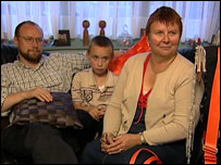 Martin, Joseph and Stella Murray try on eco-friendly clothing