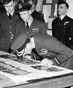 HM King George VI examines pictures