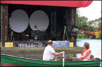 Boat rowing past the stage