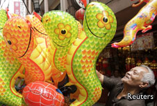 Man selling snake balloons