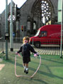 Girl skipping, Plymouth by Jenny Matthews