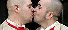 Two men kiss to celebrate their civil partnership