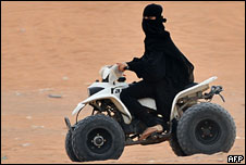 A Saudi woman drives a dune buggy
