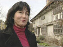 Tina Pullinger in front of the Tudor House