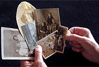 hand holding collection of photographs