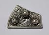 Silver fragment of a Viking brooch, decorated with an interlaced animal motif. (c) Trustees of the British Museum