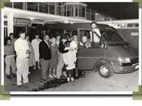 Getting on bus at day centre - black & white