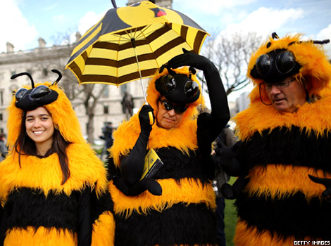 People dressed as bees protest against the use of pesticides