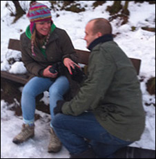 David proposing to Jennifer on one knee