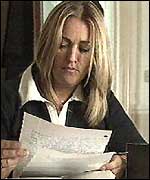 Sarah  El Madawi reading a letter