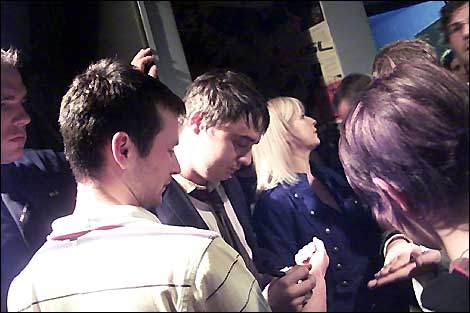 Pete Doherty signs fans autographs.