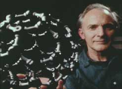 Harry Kroto with a model of a carbon molecule