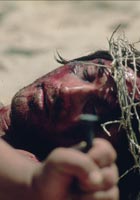 Hands nailing Jesus to the cross