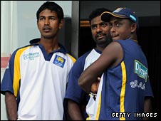 Sri Lanka players watch the rain fall in Colombo
