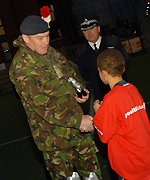 Sergeant Steve Falconer presents Marcus, 10 from Poplar a 'Star Player' award. Photographs courtesy of Sabera Bham.