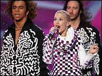 Aaron (right) performing with Kylie Minogue