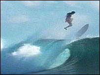 Surfer coming off his board on a wave
