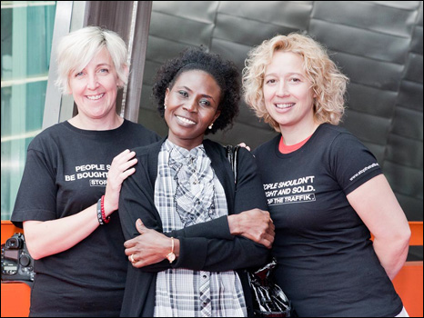 Mende Nazer (centre) campaigning as a free woman with stars of British television