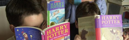 Children reading Harry Potter books
