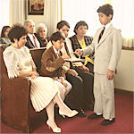 A deacon distributing the sacrament