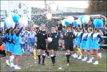 Worcester City v Huddersfield Town teams come on