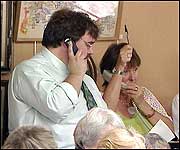 Taking telephone bids from around the world