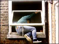 Person climbing into a window