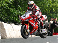 Steve Plater jumping the bridge at the Isle Of Man TT - Picture by Wally Walters.  