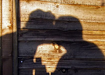 A shadow of two people kissing