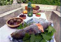 Photograph showing a table laid with various roman foods