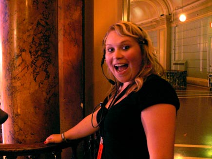 Crew member Helen Baird backstage, looking excited