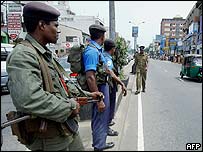 Troops stand guard on a Colombo street