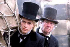 Image: Nicholas Nickleby (Charlie Hunnam) and Newman Noggs (Tom Courtney) keeping an eye on mischief, in United Artists's ensemble comedy Nicholas Nickleby