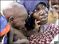 Mulher pobre com bebê