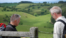 Jim and Derek crossing over a stile