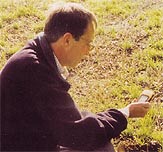 A man using a global positioning system device to track a findspot
