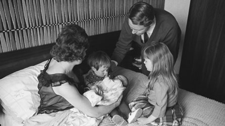 Mother in bed holding her new born child