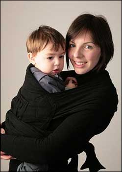 Woman holding a two year old boy.