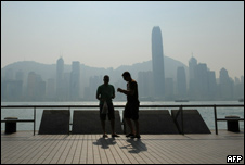 People at a harbour in Hong Kong