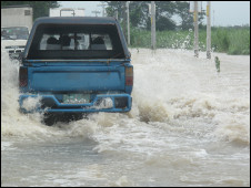 Mike Costello battled through floods caused by typhoon Juan when travelling to interview Manny Pacquiao
