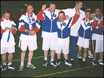 Lee Penfold and his team after winning the silver