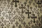 Wall covered with crosses in many different styles; photo by Kent Squires